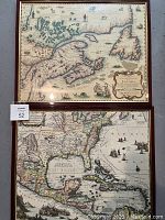 Photo showing two framed antique maps stacked vertically, top map of Canada and bottom map of southeastern U.S. and Caribbean, wooden frames, one glass cracked