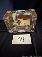 Closed original packaging front showing the Hershey's branded 1912 Ford delivery truck diecast coin bank modeled by Cearbox.
