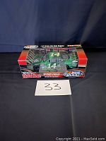 Boxed 1:24 scale die cast Conseco NASCAR race car, side view showing number 14 and packaging