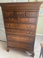 Front view of Drexel Heritage collector's edition dresser showing all nine drawers and metal handles.