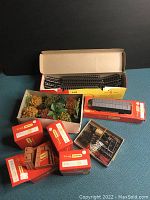 Various Tri-ang Hornby boxes with track pieces, accessories and scenic greenery