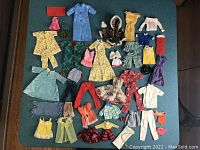 Overview of entire lot arranged on teal surface