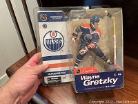 Front view of unopened Wayne Gretzky Edmonton Oilers NHL Legends action figure showing figure and packaging.