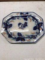 Full top view of platter showing octagonal shape and overall flow blue floral pattern