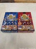 Two unopened boxes of Snack World Tre-Jara Box toys, one blue and one red, both featuring images of small collectible toys and Japanese text.