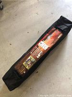 Black carrying bag with label showing Ozark Trail 10x10 Instant Gazebo.