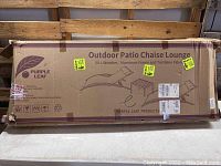 Original packaging box of the Purple Leaf outdoor patio chaise lounge, showing product name and basic design illustration.