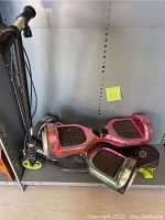 One Razor Fuzion electric scooter and two hoverboards on a shelf, showing overall condition.