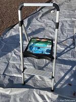 Full image of the 2 step ultra light step stool with aluminum steps, black platform, and handle.