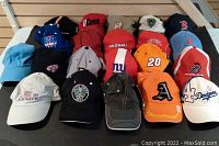 Front view of assorted colorful caps showing various logos and colors.