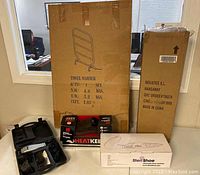 Photo showing all boxed items including towel warmer, hangaway rack, Steri Shoe box, Andis razor case, and slippers box