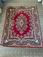 Full view of the Royal Ashan wool area rug displayed on floor showing the overall design and color pattern.