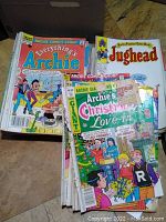 Box of various used vintage Archie comic books including Everything's Archie, Archie Giant, and Jughead comics.
