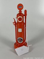 Front view of orange Gulf gas pump radio showing logo, dial, and decals