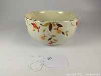 Side view of the Hall Pottery Jewel Tea Autumn Leaf deep bowl showing the leaf pattern and fluted design.