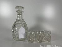 Decanter with stopper and six whiskey tumblers in Cape Cod pattern by Imperial Glass.