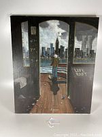 Front view of original oil painting showing the person on ship deck looking at NYC skyline at night with graffiti on walls.