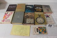 Photo showing the full lot of 12 psychic-related books and pamphlets.