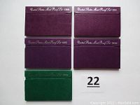 Five original proof set folders from 1989, 1991, 1992, 1993, and 1994 with visible text on covers.