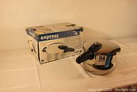 Fagor Express pressure cooker with original box showing the cooker and box from an angle.