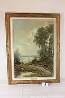 Frontal view of framed landscape oil painting by Emanuel Embler
