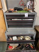 Overall view of gray Craftsman top chest and bottom cabinet on caster wheels