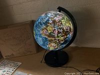 Lit globe showing colorful constellation outlines.