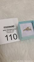 Photo of the 10k yellow gold ring with pearl and diamond accent in a light blue jewelry box alongside a MaxSold auction tag number 110.