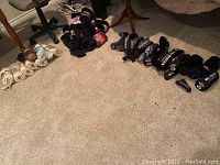 Overview of multiple golf club covers arranged on carpeted floor