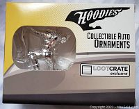 Silver arrow figurine in package front with Loot Crate exclusive and Hoodies branding