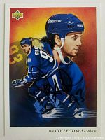 Front view of upper deck Doug Gilmour hockey card with autograph across card