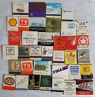 Top view of laid out advertising matchbooks showing logos and text
