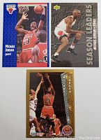 Three Michael Jordan basketball cards showing front images with detailed player photographs and card designs.