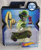 Front view of Hot Wheels The Riddler character car sealed in original packaging with DC Comics branded backing card.