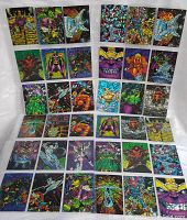 Full layout of about 46 Silver Surfer and Marvel character trading cards arranged on a flat surface.