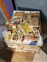 Top view of one tray with various rubber stamps including a colored map and decorative designs