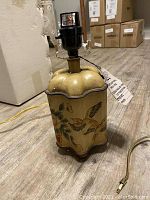 Pair of accent lamps bases with bird and floral painted designs visible, lamp fitting and wiring shown