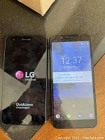 Two LG smartphones side by side, one powered on, the other showing LG startup logo and Qualcomm Snapdragon branding.