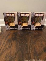 Three Cooperstown Collection baseball musical snow globes in original boxes, showing packaging and logos.