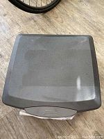 Top-down view of the closed gray fireproof and waterproof safe showing a slightly textured surface.