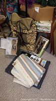 Overview photo showing the leopard print rolling duffle bag, Vionic shoes, entry mat, Pier 1 rug and other shoes