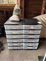 Front view of two black-framed IRIS mini chest storage units with clear plastic drawers, labels on several drawers. Jobsite mop placed on top of one storage unit.