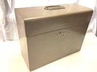 Full view of the closed metal toolbox showing overall size, shape, and finish.