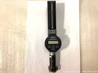 Full length photo of Mitutoyo Borematic Digimatic bore gage showing handle, body, and measuring probe.