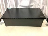 Closed view of black Siemens battery box model BB-55 enclosure, showing entire outer case with lock visible on front right side.