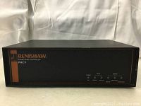 Front panel view showing Renishaw branding, model PHC9, and indicator lights.