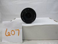 Front view of Sigma 18-200mm lens showing front glass element and markings