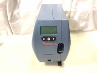 Front view of blue-gray lab slide printer with digital display and control buttons, showing 'Thermo Scientific' and 'Slide Mate' branding.