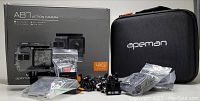 Apeman A87 action camera box, camera in waterproof case, assorted mounts and accessories, rechargeable batteries, cables, and branded carrying case all displayed.