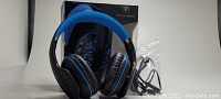 Black and blue Beexcellent Q2 wireless headset with original box, charging cord, and connection wire displayed on white background.